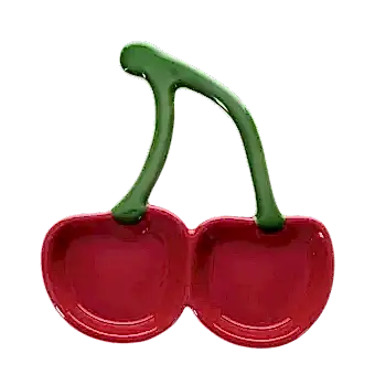 Red ceramic trinket dish shaped like two cherries with green stems.