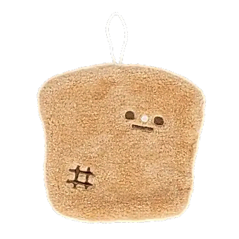 Brown kitchen cloth shaped like a slice of bread with embroidered face and hanging loop