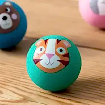 Green bouncy ball with a tiger face design