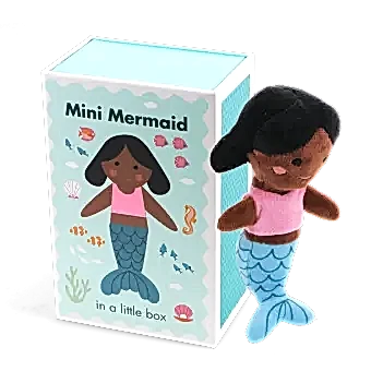 Mini mermaid soft toy placed beside a small illustrated box with mermaid design