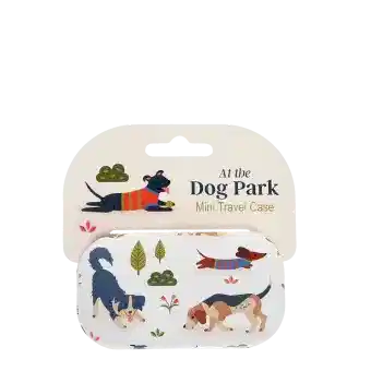 Mini travel case with playful illustrated dogs and trees on a light background