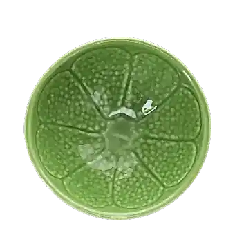 Green ceramic bowl with textured lime-like pattern and glossy finish.
